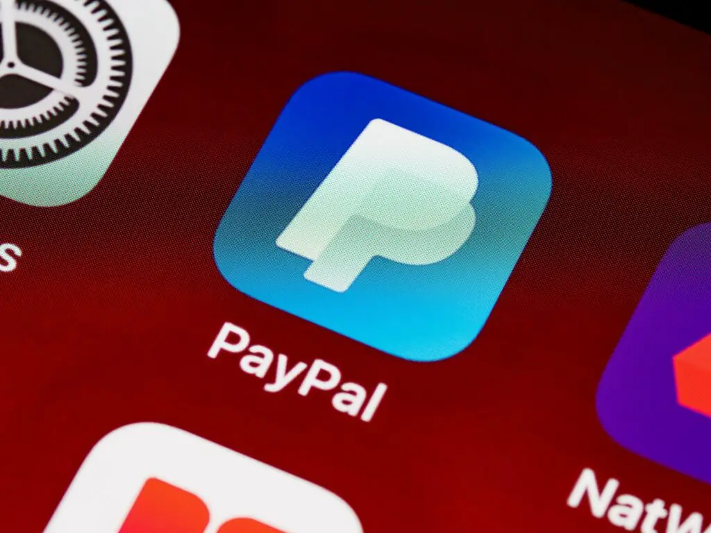 A close-up of a phone screen and the PayPal app