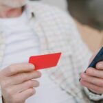 Person using a card and a phone