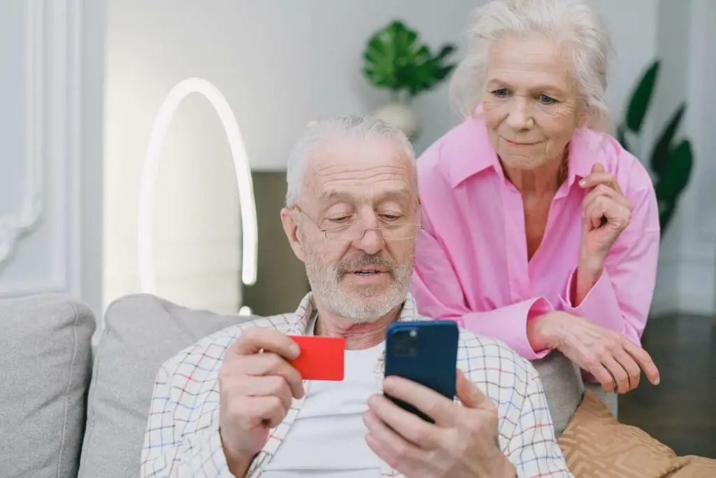 An elderly couple making an online purchase