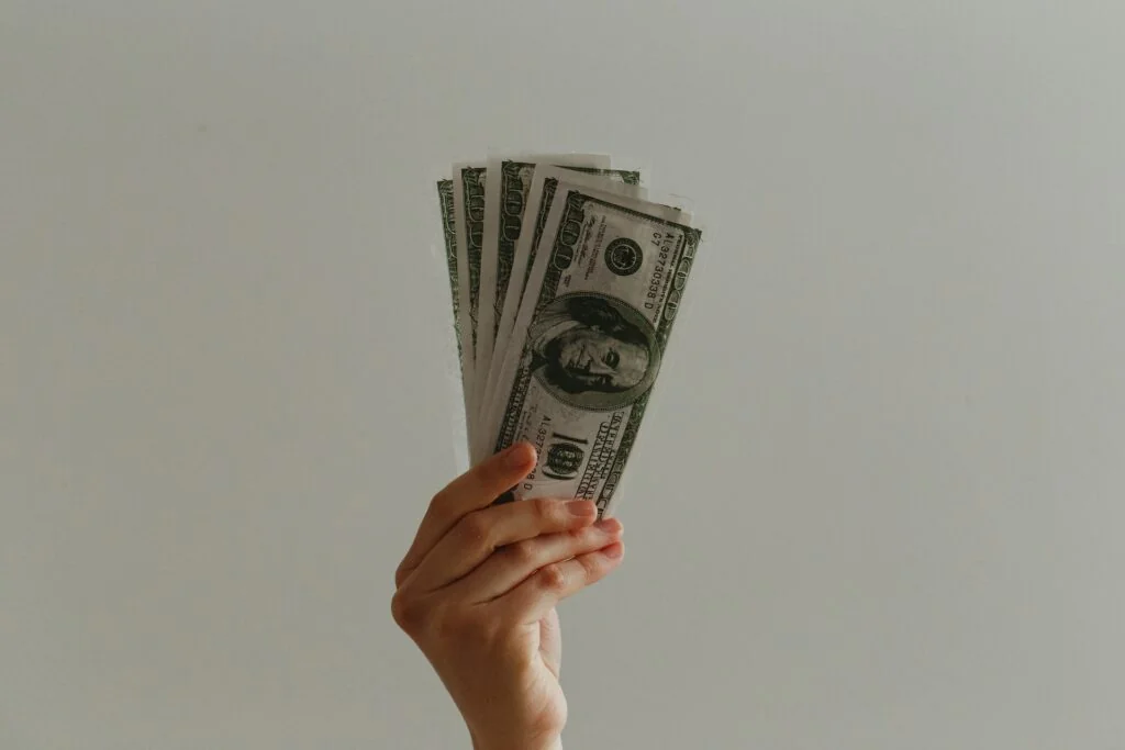 A person holding cash