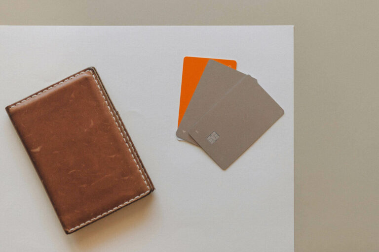 Brown wallet and credit cards on a table