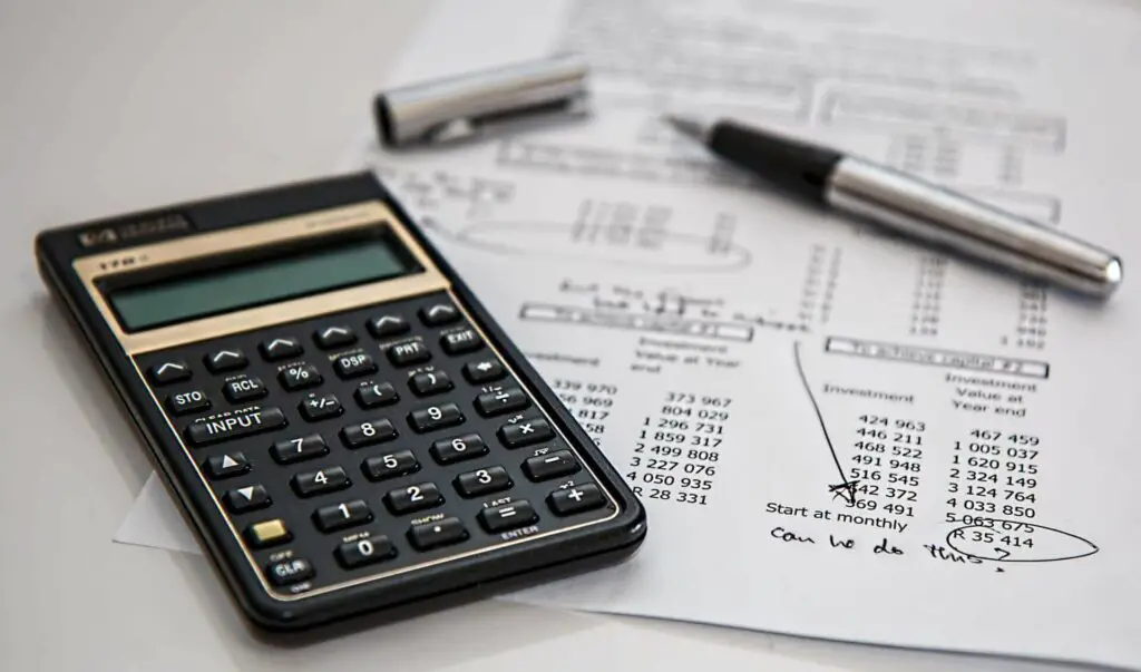 Financial paperwork underneath a calculator